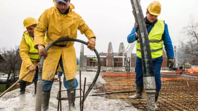 construction-workers-pouring-cement-on-roof